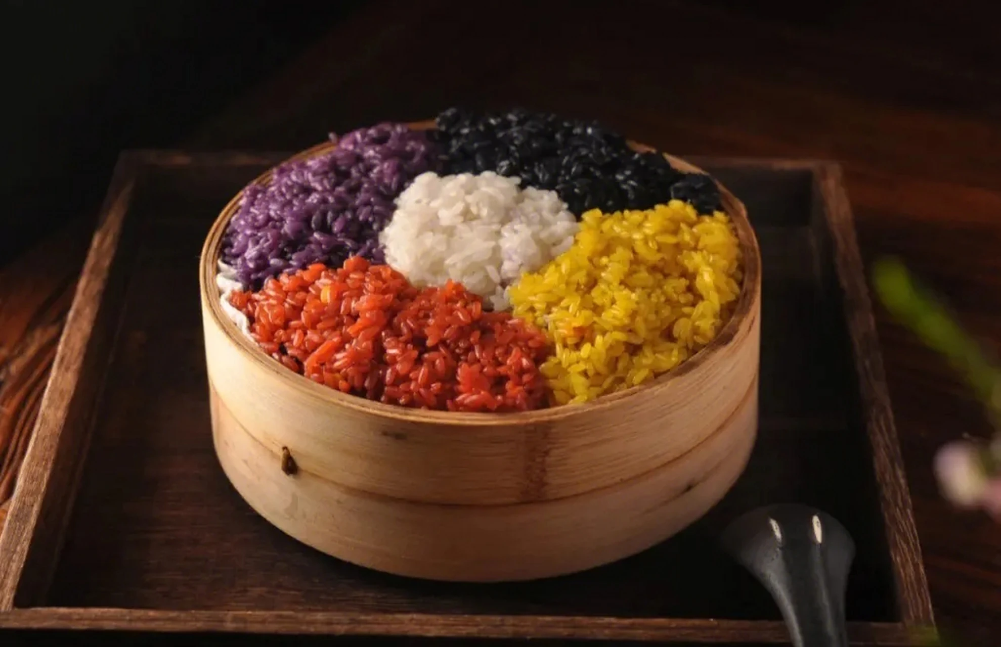 Five-color glutinous rice steamed in a bamboo basket — scenic food photograph in China